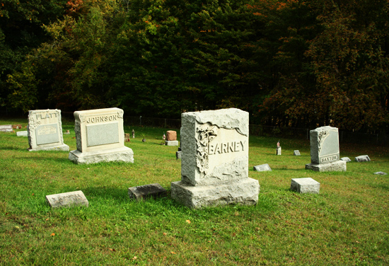 4 gravestones: Flatt, Johnson, Barney, Saxton
