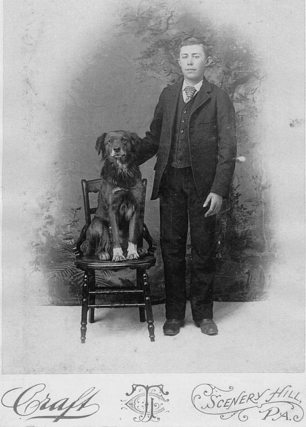 Unknown early-teenage Boy with dog